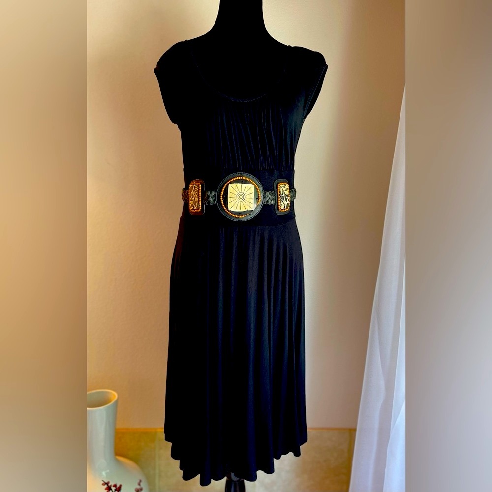 Simple black dress with built-in accents.